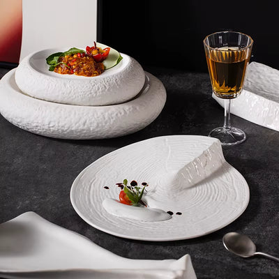 Elegant fine dining plate featuring cherry tomato, microgreens, and white sauce artfully styled with textured white ceramic dishes and amber drink—perfect for USA gourmet aesthetic and Friday branding.

