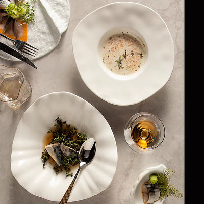 "Elegant fish platter with herbs and white sauce"
